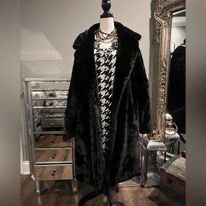 This fabulous brand new coat is soft and luxurious. It fits like a glove.